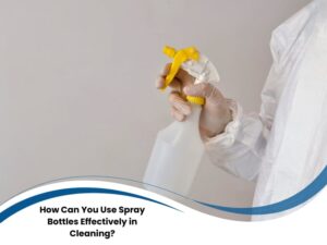 Cleaner in protective suit using a trigger sprayer, showing practical spray bottle uses in cleaning tasks.